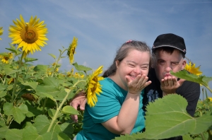 Couple with Down Syndrome in Sunflower Field