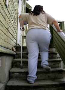 Woman with Cane Walking up Stairs